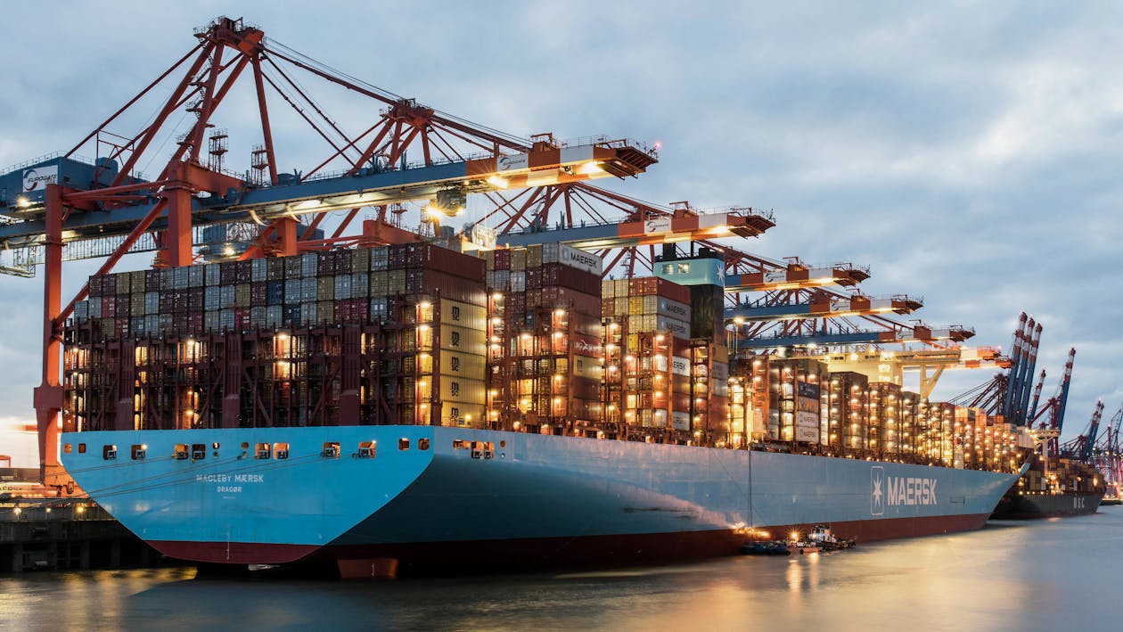 Cranes loading container ship at international port